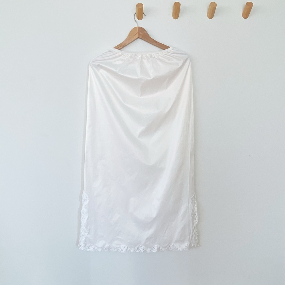 Vintage pale pate white nylon slip skirt with creamy floral lace trim